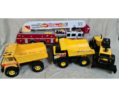 A large Tonka fire engine, a Nylint dump truck, a Tonka dump truck and a Tonka articulated bulldozer.  