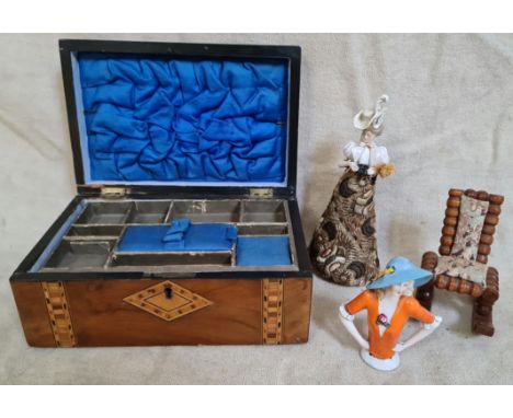 A Victorian inlaid walnut sewing box, two vintage pin cushion dolls and a treen rocking chair pin cushion.  