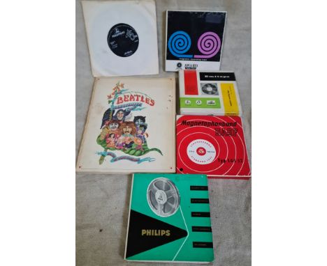 A First Edition paperback "The Beatles Illustrated Lyrics" plus two original Beatles 45 records and four vintage reel to reel