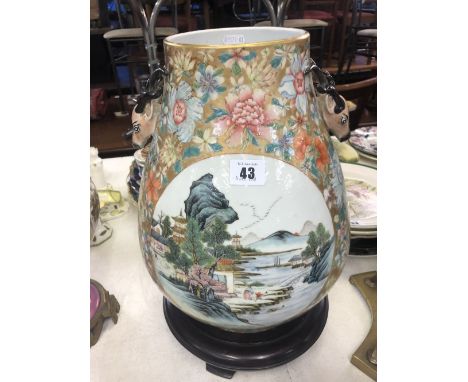 A Chinese famille rose vase with deer head handles with seal mark to base, approx. 34cms high and 24cms widest point