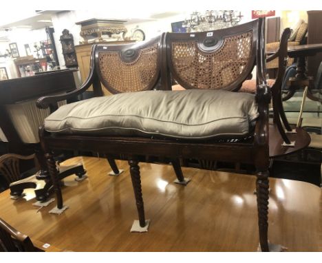 A mahogany bergere two seater salon sofa