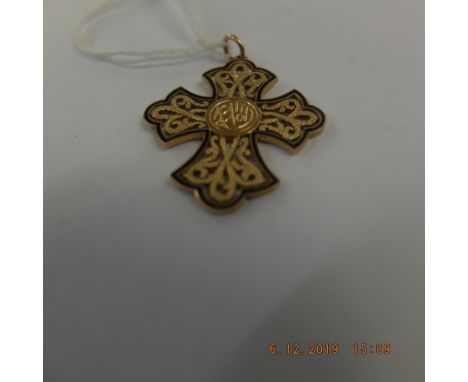 A gold and enamel cross pendant weight 7 grams marked 18k 