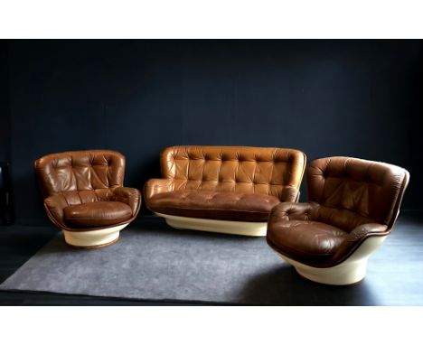 Michel CADESTIN (1942- ) - Set of two armchairs and a two-seater sofa model "Karate" in cognac leather and fibreglass and pol