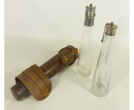 Early 20th Century Leather cased hunting flask with a conical glass flask and silver plated screw cap and a similar additiona