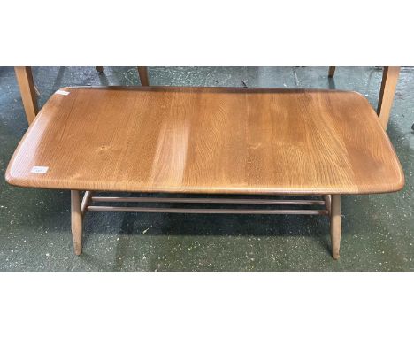 An Ercol light elm coffee table of rectangular form with base shelf, 105cm wide