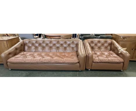 A mid Century brown leather three seater sofa and accompanying armchair, both 195cm wide (2)