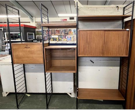 A Ladderax teak and iron framed room divider or shelf unit incorporating bureau section, a glazed display cabinet, a cupboard