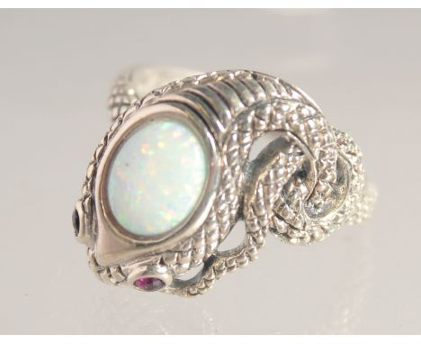 A SILVER RUBY EYE AND GILSON OPAL SNAKE RING.