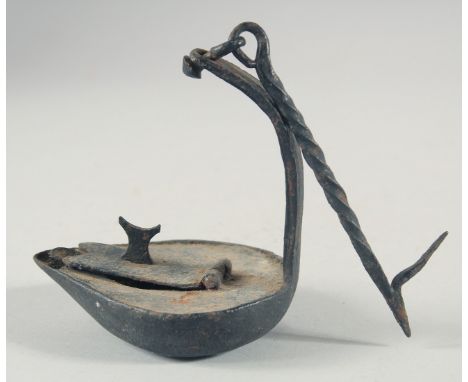 AN EARLY 19TH CENTURY METAL WHALE OIL LAMP.