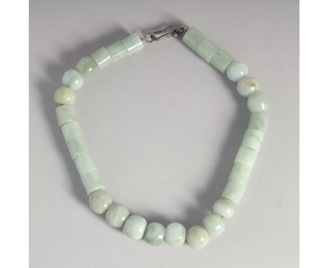 A GREY JADE NECKLACE.