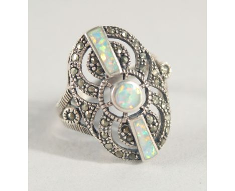 A SILVER AND OPAL RING.