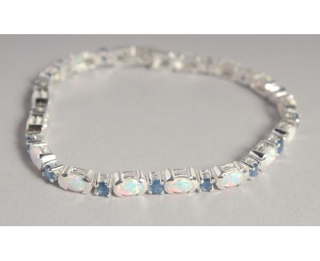 A SILVER SAPPHIRE AND OPAL LINE BRACELET.