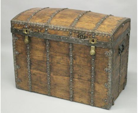 A GOOD DOME TOP TRAVELLING TRUNK, circa. 1900, Parisian Malletier, La Bazar du Voyage, the wooden body with pierced strapwork