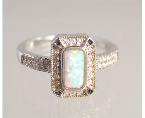 A SILVER AND GILSON OPAL DECO STYLE RING.