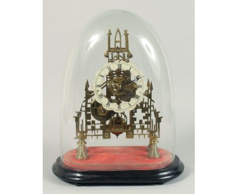 A GOOD VICTORIAN BRASS CATHEDRAL SKELETON CLOCK with black and white Roman numerals, fusee mount on a green felt base. 12ins 