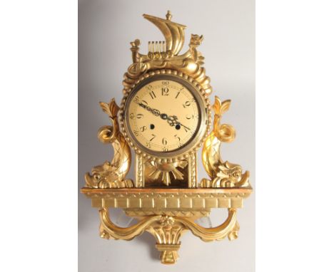 A SCANDINAVIAN GILT WALL CLOCK. 22ins long.