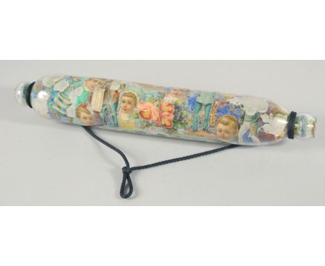 A DECOUPAGE ROLLING PIN. 15ins long.