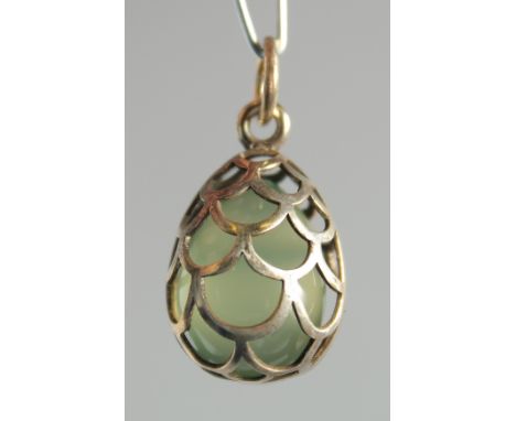 A RUSSIAN SILVER AND JADE EGG PENDANT.