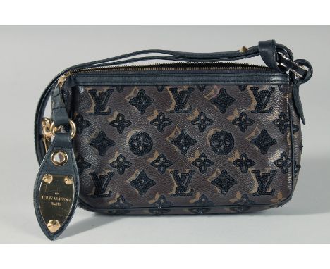 Sold at Auction: A LOUIS VUITTON BEAD EVENING BAG. 8ins long, 5ins deep.