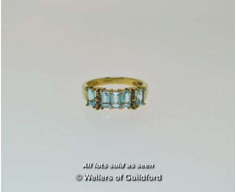 Five stone blue topaz and diamond ring, five rectangular step cut blue topaz stones with four small round cut diamonds, mount