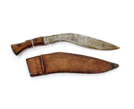 A Second World War Military Issue Kukri, the curved steel blade marked SA/24, the ricasso stamped PAT.CO./1945, with rivetted