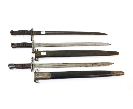 Three Remington 1917 Pattern Bayonets, one with rare 1918 date mark, each with blade stamped with maker's mark, a flaming gre