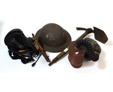 A Second World War British Entrenching Tool, the blade stamped ERKS with broad arrow and dated 1942, with wood haft; a Static