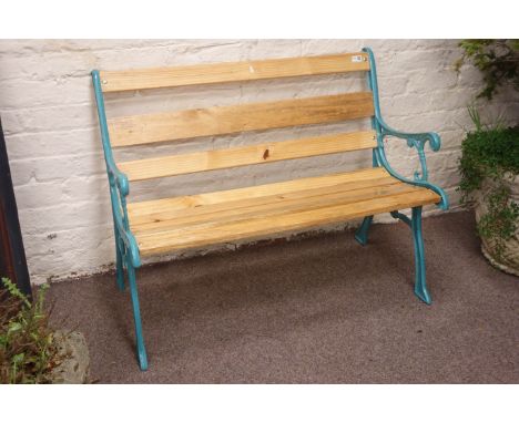 Polished pine slatted garden bench with light blue painted cast iron end supports, W105cm