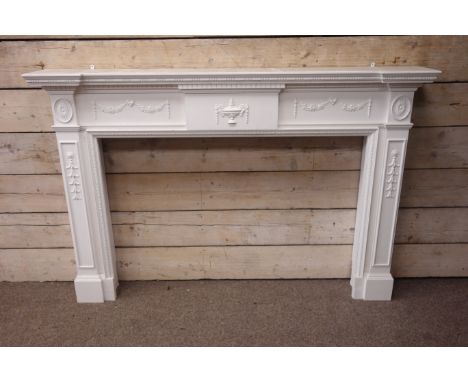 Large 20th century Adams style reverse breakfront fire surround, white painted wood, projecting dentil cornice, decorated wit