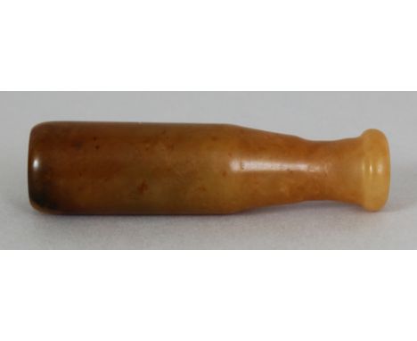 A CHINESE JADE CIGARETTE HOLDER, 2.6in long.