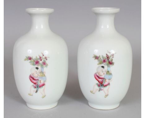 A PAIR OF GOOD QUALITY CHINESE FAMILLE ROSE PORCELAIN VASES, each vase painted with three boys bearing vases of flowers, each