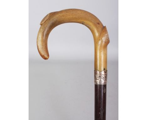 ANOTHER HORN HANDLED WOOD WALKING STICK, with a hallmarked embossed silver collar, the horn possibly rhinoceros horn, 32.25in