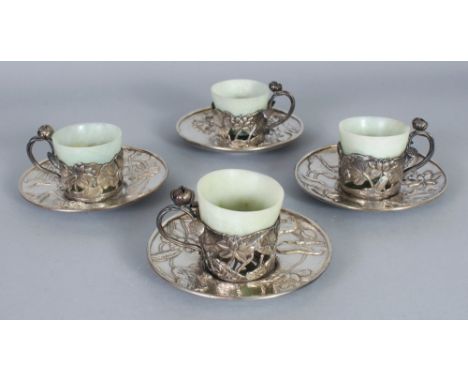 A SET OF FOUR FINE QUALITY EARLY 20TH CENTURY JAPANESE ART NOUVEAU STYLE SILVER & JADE CUPS, the individually worked lotus de