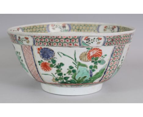 A LARGE CHINESE KANGXI PERIOD FAMILLE VERTE PORCELAIN BOWL, circa 1700, the interior centre with lotus, the sides painted wit