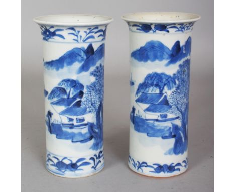 A PAIR OF 19TH CENTURY CHINESE BLUE & WHITE RIVER LANDSCAPE CYLINDRICAL PORCELAIN VASES, each base with a four-character Kang