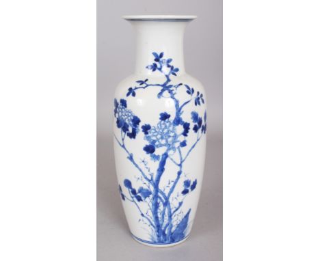 A 19TH CENTURY CHINESE BLUE & WHITE PORCELAIN VASE, painted with branches of leaf-stemmed peony, the base with a four-charact