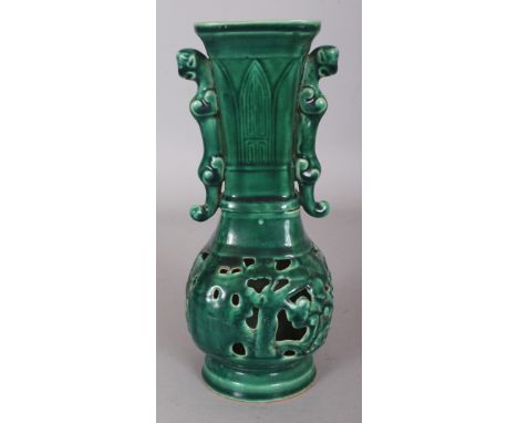 A CHINESE MING STYLE GREEN GLAZED PIERCED CERAMIC VASE, the base with an archaic three-character mark, 9.2in high.