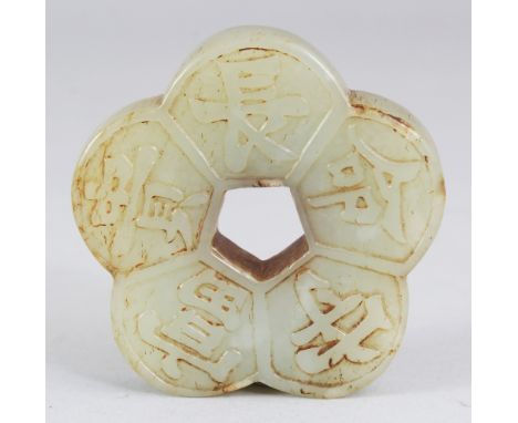 A CHINESE CELADON JADE PENDANT, of lobed pentafoil form, decorated with auspicious characters, 2in wide.
