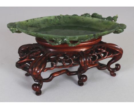A FINE QUALITY 19TH/20TH CENTURY CHINESE GREEN JADE OVAL BRUSHWASHER, together with a good quality fitted wood stand, the rim