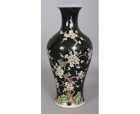 A CHINESE FAMILLE NOIRE BALUSTER PORCELAIN VASE, the base with a six-character Kangxi mark, 11.2in high.