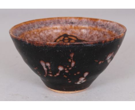 A CHINESE SONG STYLE PAPERCUT CERAMIC BOWL, the base unglazed, 4.6in diameter at rim & 2.4in high.