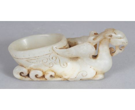 A GOOD CHINESE WHITE JADE PHOENIX LIBATION BOWL, of archaic form and design, 3.5in long & 1.5in high.