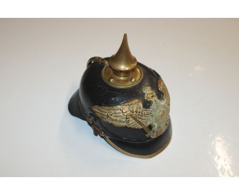 A pre WWI Prussian Pickelhaube, this example an Ordinary Ranks Guards model with leather chin strap and a "State" cockade (po