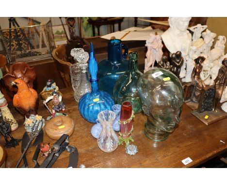 A glass mannequin head; decanters; blue glass decanter; Caithness glass vases; a Millefiori decorated paperweight etc.