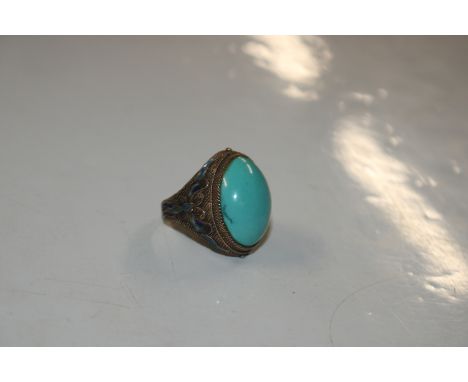 A silver gilt and turquoise set ring with enamel butterfly decoration