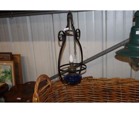 A hanging oil lamp and a copper kettle 