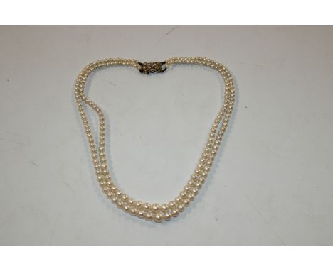 A pearl necklace with 9ct gold clasp