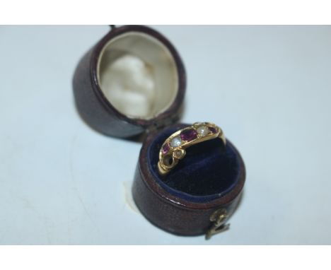 A yellow metal amethyst and pearl set ring, ring size M/N, approx. 2.2gms 