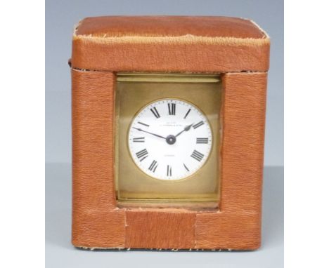 Rockbank and Atkin London, brass carriage clock in corniche style case, the enamelled Roman dial with blue spade hands, in or