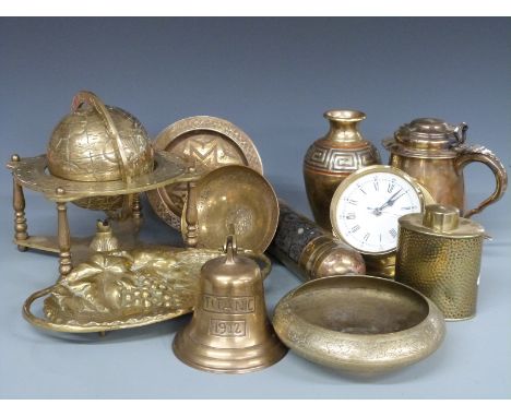 A collection of brassware including Arts and Crafts hammered caddy, globe, fire extinguisher, replica Titanic bell, Cairo war